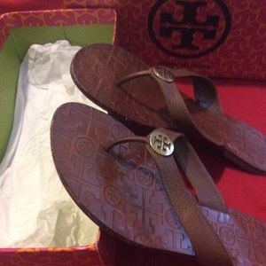 Tan Leather flats with a gold TB hardware.